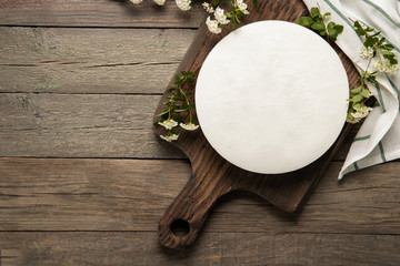 Tasty homemade cheesecake on a wooden background. Place for text.