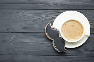 Happy father's day concept. Cup of cafe and cookies on a wooden background. Place for text
