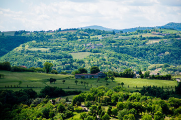 the stone house in the center of the greenery