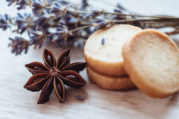 Fototapeta na wymiar Aromatic lavender cookies, handmade. French cuisine. Shortbread cookies on light wooden table. Gift with your own hands.