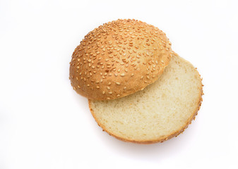 Fresh fragrant bun for burgers with sesame seeds on a white background. Can be used for advertising