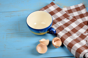 scrambled eggs with chives, a colorful sandwich and tea on an old blue table