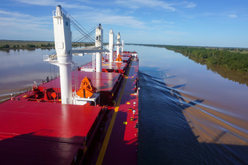 Vessel proceeding up the Parana River. Type of ship: Bulk carrier with cranes. Rio Parana,...