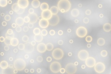 Silver bokeh background. Christmas glowing silver and golden lights with sparkles. Holiday decorative effect.