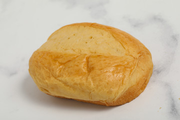 Breakfast buns on white marble background. Sweet brioche