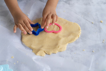 kid hands with cookie cutter