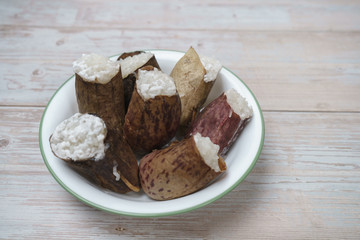 Glutinous rice steamed cooked with coconut milk in pitcher plants known as lemang periuk kera is a traditional malay  food famous during Eidul Fitri festive and rarely to find. Selective focus.
