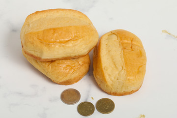 Breakfast buns on white marble background. Sweet brioche