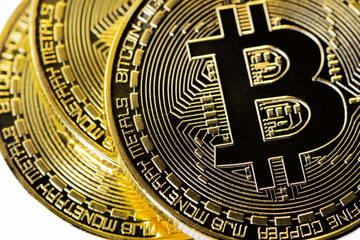 Fototapeta na wymiar Crypto currency Closeup Golden Bitcoins. Photo virtual money.Blockchain technology, bitcoin mining concept.