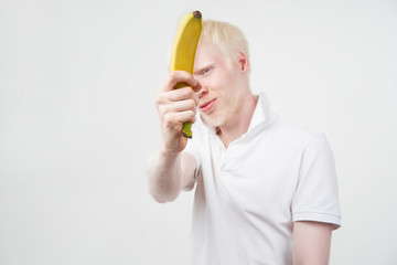 portrait of an albino man in studio dressed t-shirt isolated on a white background. abnormal deviations. unusual appearance