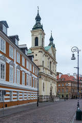 Obraz premium Warsaw old street with the church. Poland