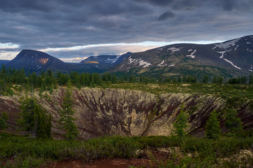 Crater of an extinct volcano. View from above. Volcanic terrain.