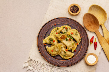 Dumplings stuffed stewed cabbage and sour cream. Traditional Ukrainian dish varenyky