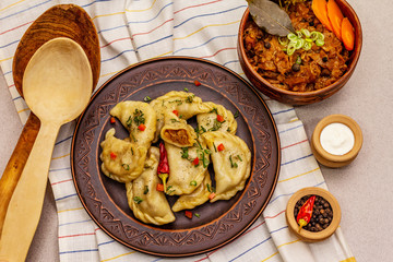 Dumplings stuffed stewed cabbage and sour cream. Traditional Ukrainian dish varenyky