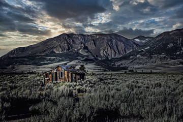 abandon mountain shack with clouds