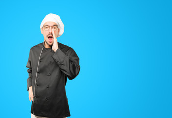 Angry young chef trying to say something strongly