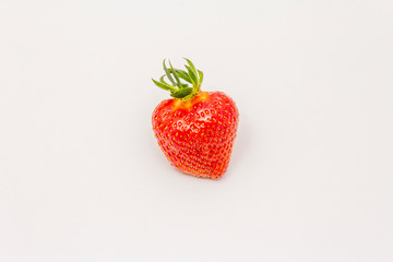 Whole sweet fresh strawberry isolated on white background