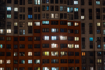 Butovo Park, Leninsky district of Moscow region, Russia-2020 . An area with numerous residential buildings. Suburbs. Suburban town in lights. Multicolored light in the Windows. Evening in the city.