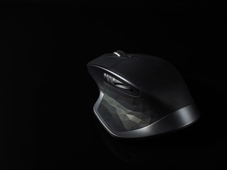 Close up grey computer gaming mouse on black background