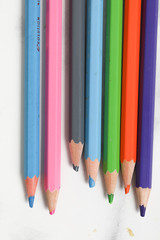 close up of color pencils on white background