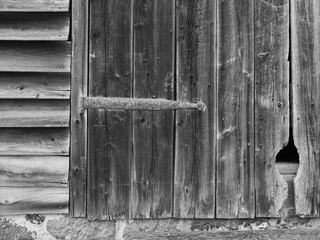 Old wood barn doors and rusted images in black and white