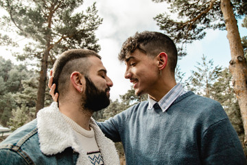 Fototapeta premium Gay couple in love at the forest