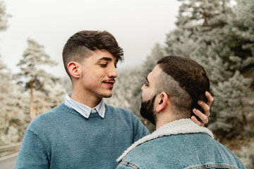 Gay couple in love at the forest