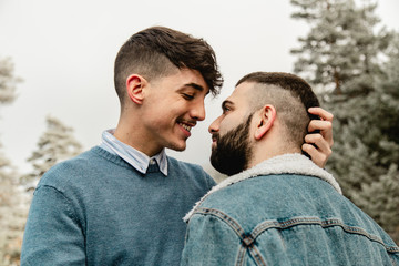 Gay couple in love at the forest