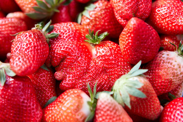 Freshly harvested Sybilla strawberry – background, directly above