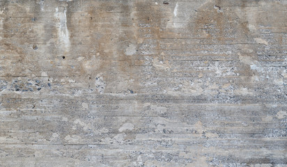Weathered and old concrete wall texture. Plastering is partly peeled off. Abstract high resolution full frame textured background.