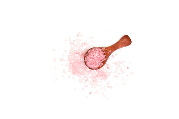 Pink salt isolated in scoop on white background. selective focus or blurry.