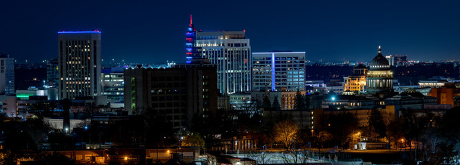 Classic Boise Skyline at night with streetlights on and blue sky