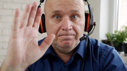 Man Working from Home and Talking in a Video Call Using Laptop Webcam and Headphones, Social...