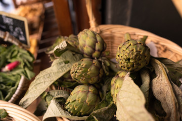 Artichokes on display in a basket at the Organic Market