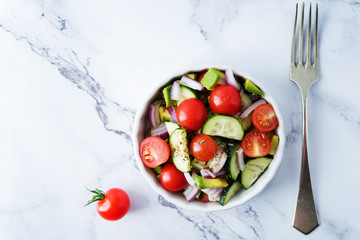 Cucumber tomato avocado red onion salad