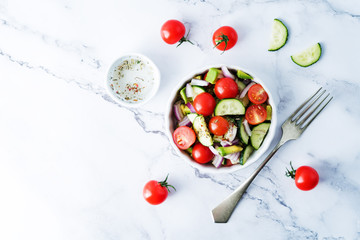 Cucumber tomato avocado red onion salad