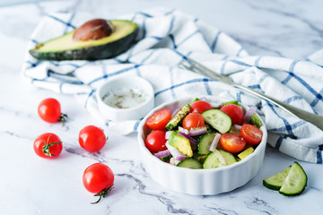 Cucumber tomato avocado red onion salad