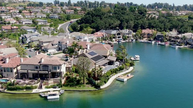 Aerial view of Lake Mission Viejo, with recreational facilities, surrounded by private residential and condominium communities. Orange County, California, USA