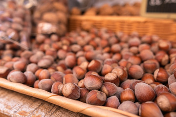 Hazelnuts on display in a basket at the Organic Market