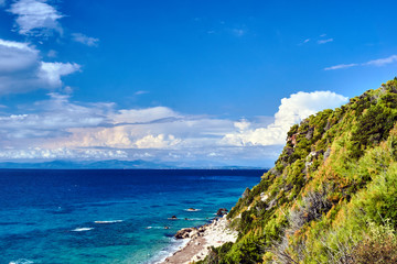 Fototapeta premium stone beach and Rocky cliff on the Greek island of Lefkada.