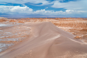 Fototapeta na wymiar Sand dunes at the Moon Valley (Spanish: Valle de la Luna ) in the Atacama Desert, Chile, South America.