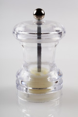 Empty mill for pepper, spices. White background. Close-up