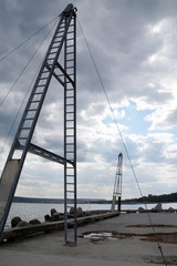   metal structure on the pier for pulling the rope when learning kiting
