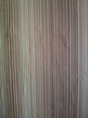Obraz premium The texture of the paper embossed wallpaper is beige and brown.