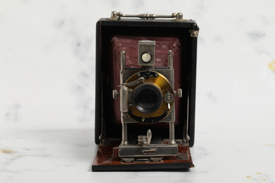 Beautiful turn of the century wooden view camera with red bellows