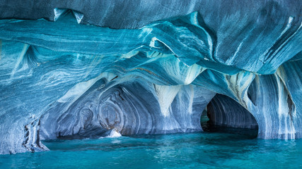 The Marble Caves (Spanish: Cuevas de Marmol ), a series of naturally sculpted caves in the General Carrera Lake in Chile, Patagonia, South America. - obrazy, fototapety, plakaty