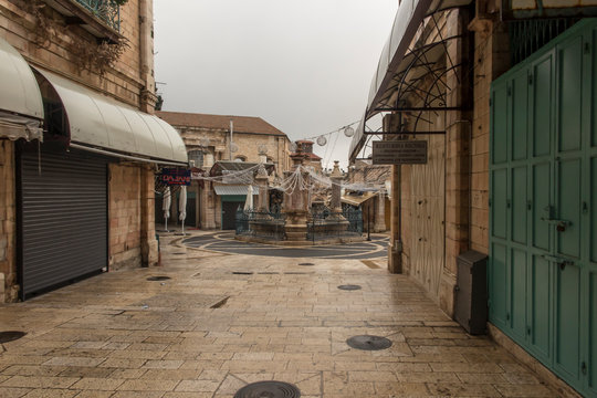 Old City of Jerusalem - Christian Quarter, empty street and square in the morning in rainy weather.  Israel