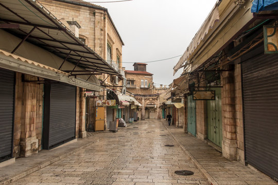 Old City of Jerusalem - Christian Quarter, empty street and square in the morning in rainy weather.  Israel
