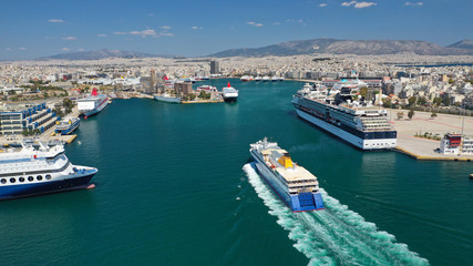 Aerial drone photo of passenger ferry reaching destination - busy port of Piraeus, Attica, Greece