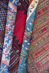 Rows of colourful silk scarfs hanging at a market stall in Istanbul, Turkey